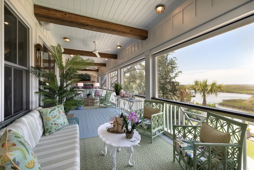 The colorful porch of a Southern home overlooking the Lowcountry marsh